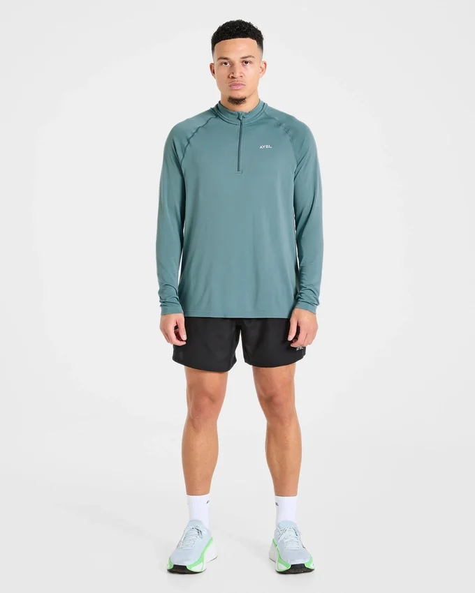 Pull Attain sans coutures à demi-zip