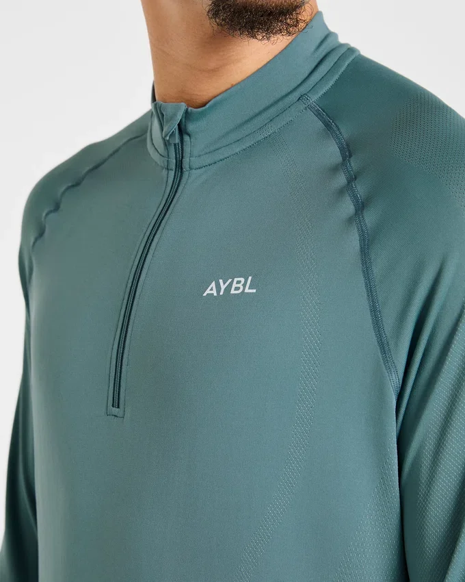 Pull Attain sans coutures à demi-zip