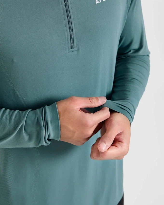 Pull Attain sans coutures à demi-zip