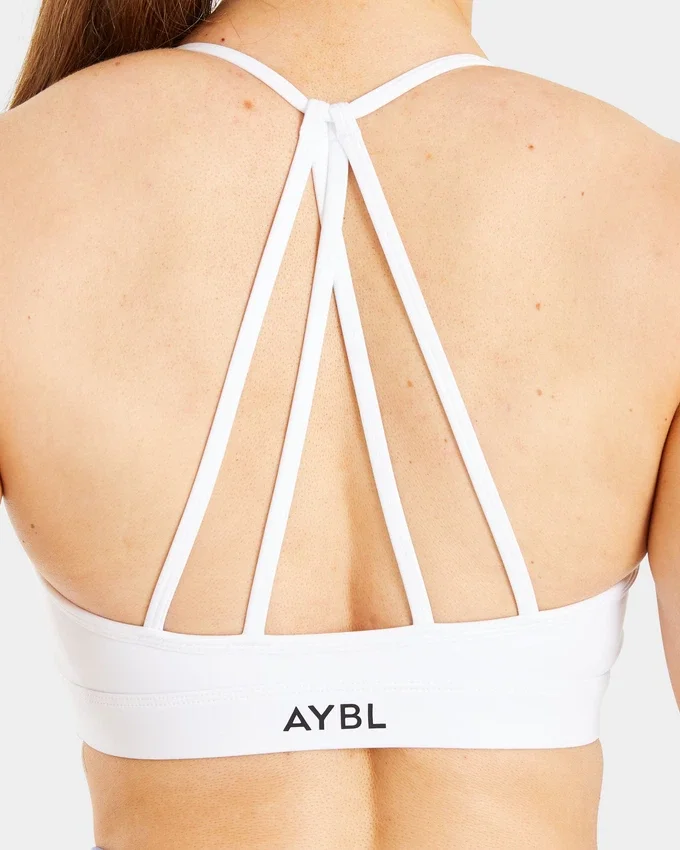 Soutien-gorge de sport à bretelles et col en V « Essential »
