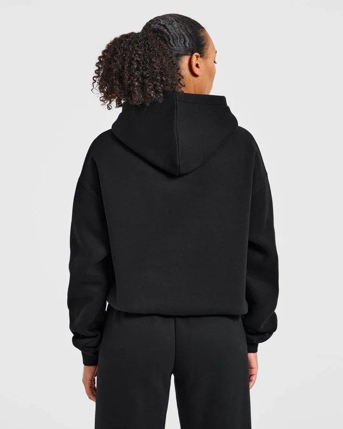 Sweat à capuche oversize avec applique « Varsity »