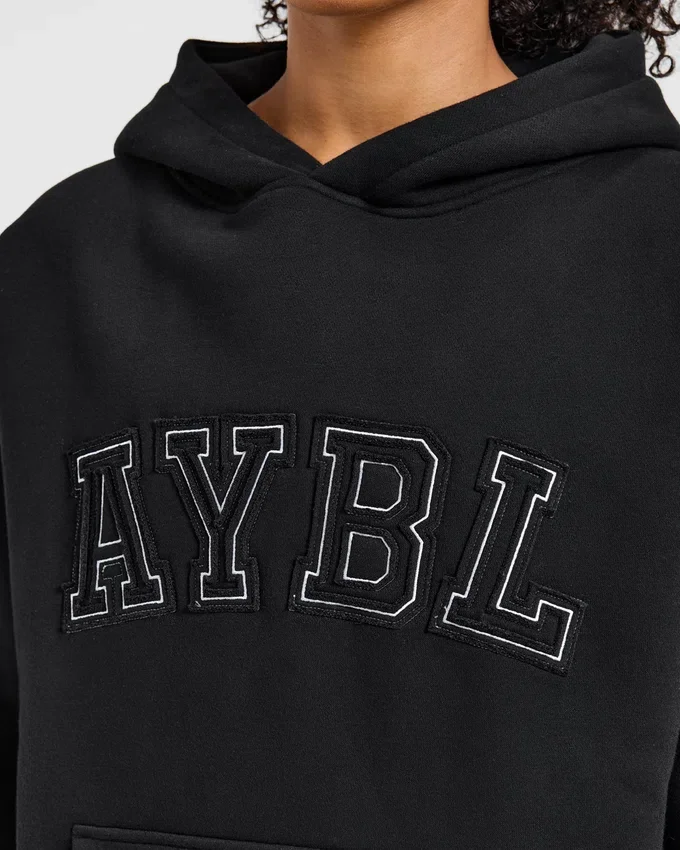Sweat à capuche oversize avec applique « Varsity »