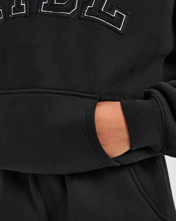Sweat à capuche oversize avec applique « Varsity »