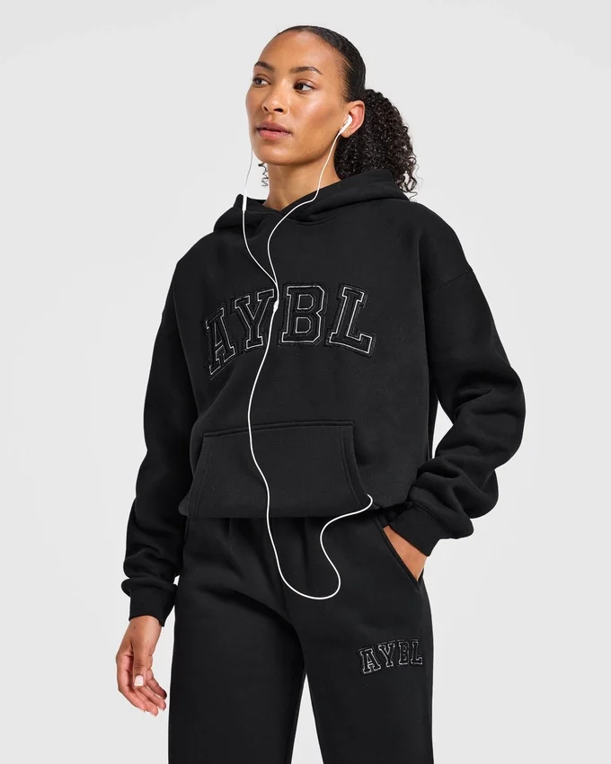 Sweat à capuche oversize avec applique « Varsity »