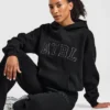 Sweat à capuche oversize avec applique « Varsity »