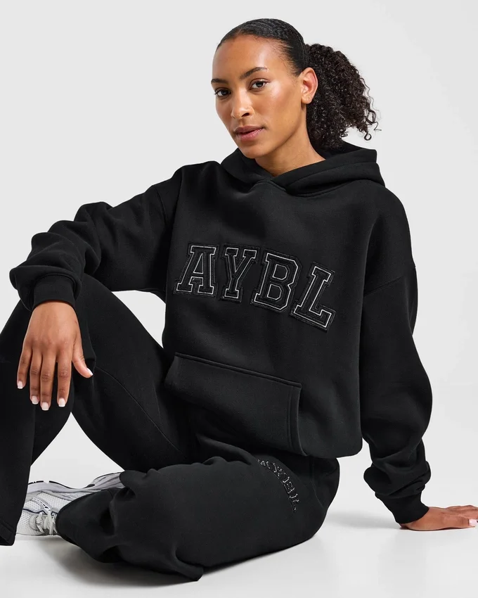 Sweat à capuche oversize avec applique « Varsity »