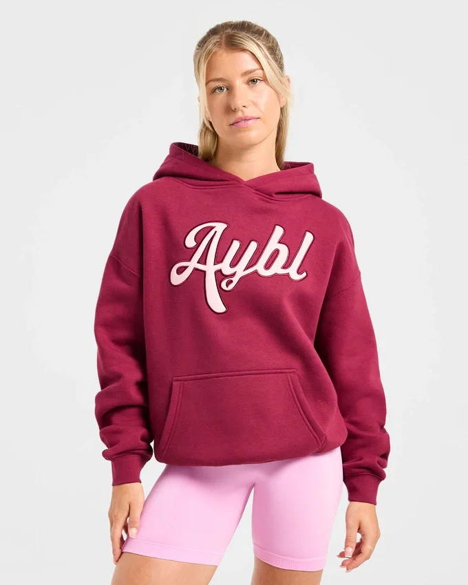 Sweat à capuche oversize avec inscription brodée