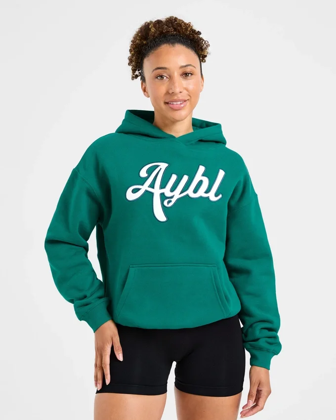 Sweat à capuche oversize avec inscription brodée