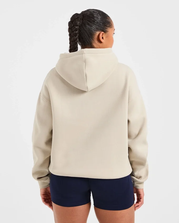 Sweat à capuche oversize avec inscription brodée