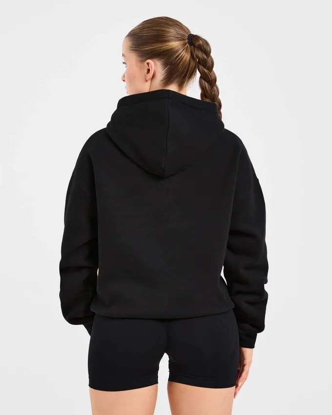 Sweat à capuche oversize avec inscription brodée