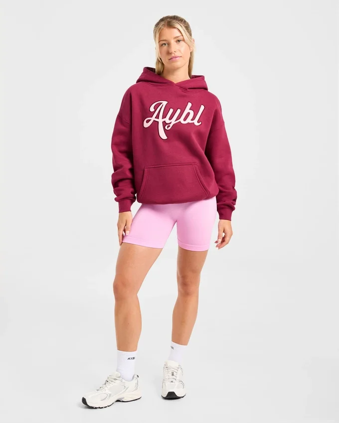 Sweat à capuche oversize avec inscription brodée