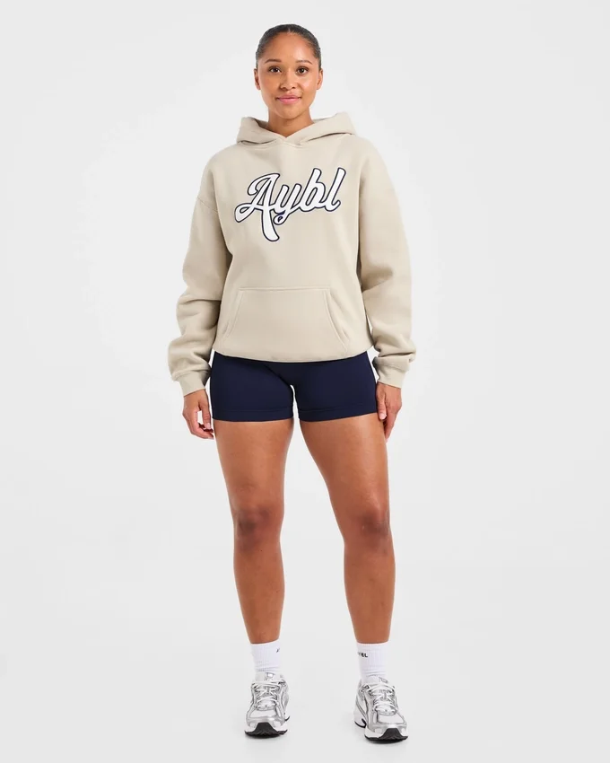 Sweat à capuche oversize avec inscription brodée