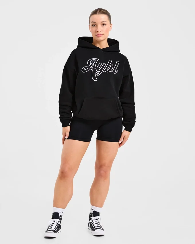 Sweat à capuche oversize avec inscription brodée