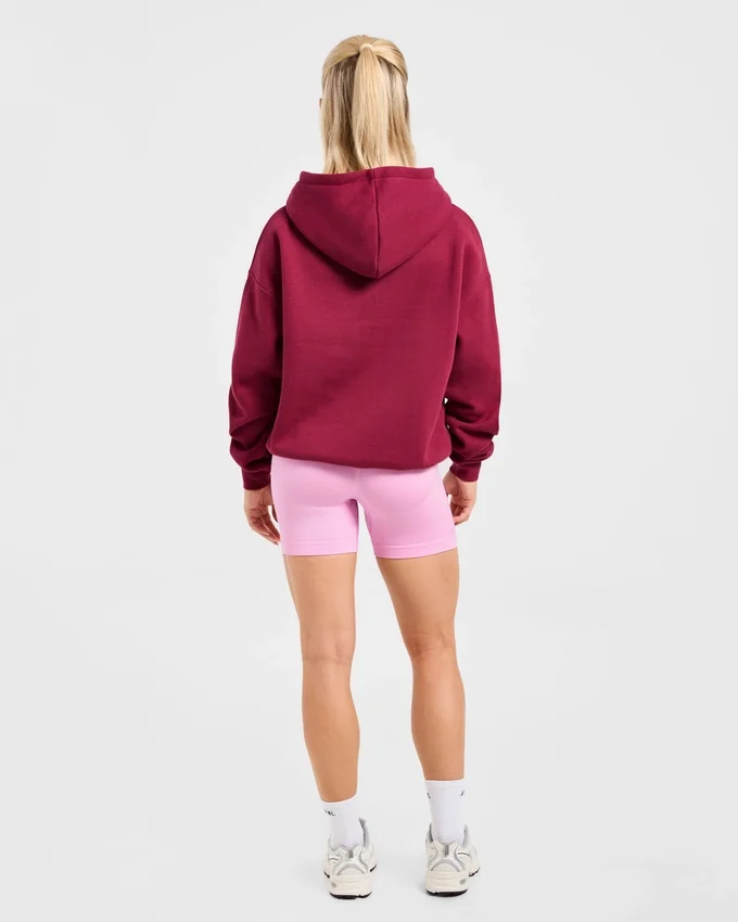 Sweat à capuche oversize avec inscription brodée