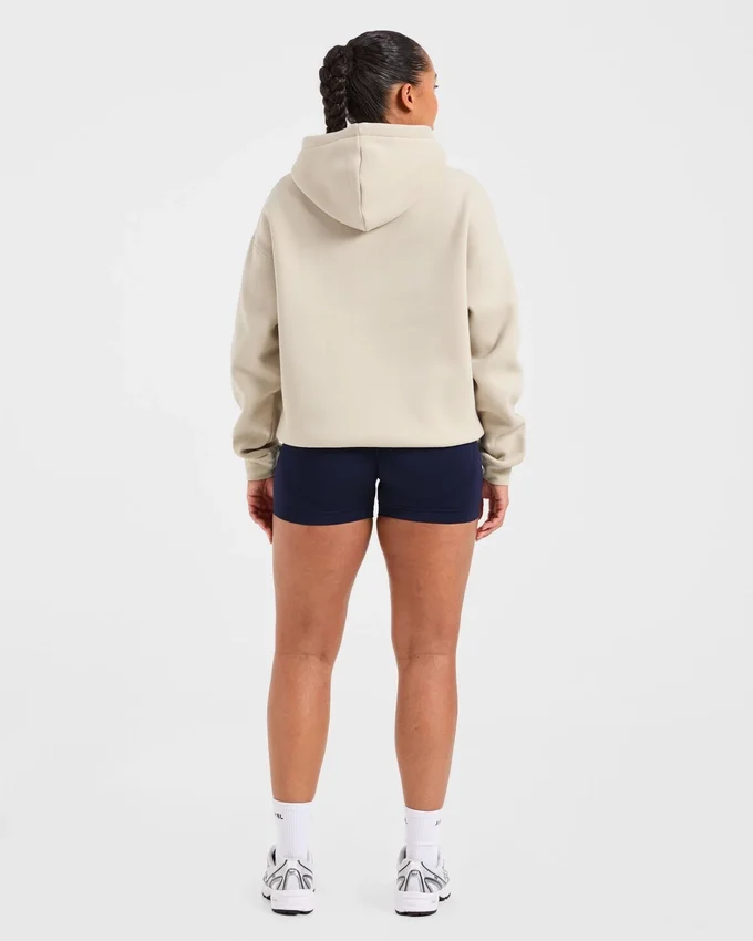 Sweat à capuche oversize avec inscription brodée