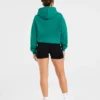 Sweat à capuche oversize avec inscription brodée