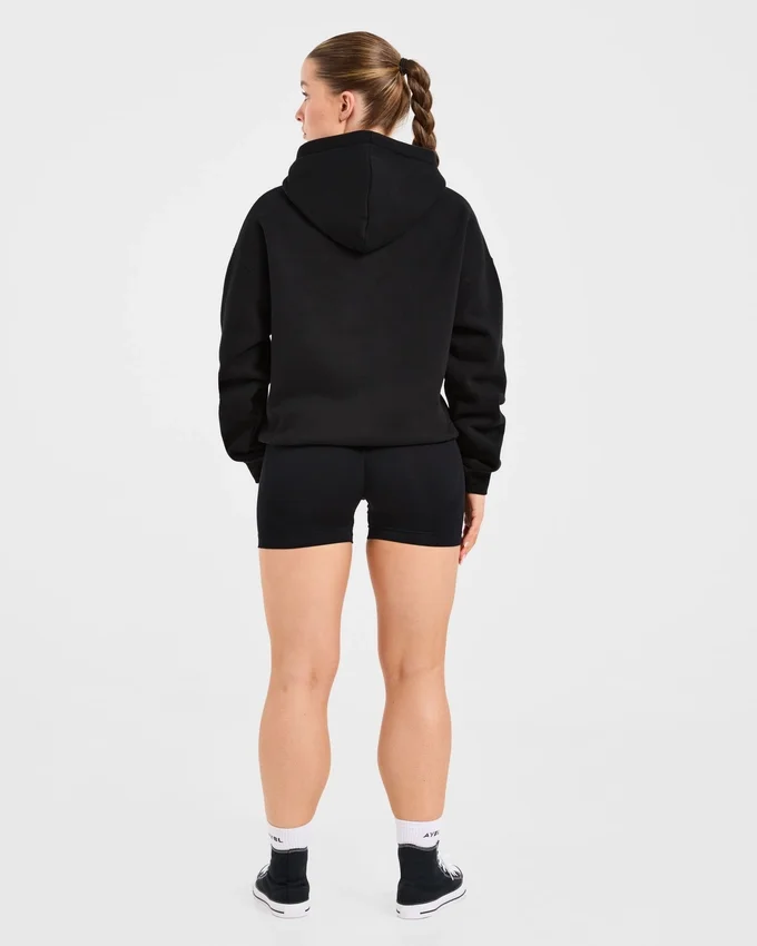 Sweat à capuche oversize avec inscription brodée