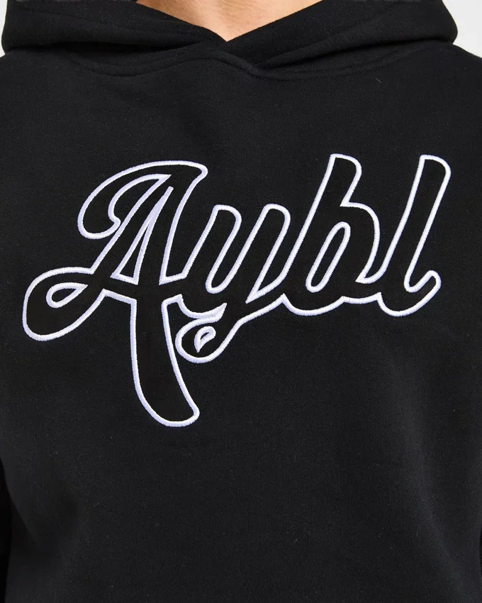 Sweat à capuche oversize avec inscription brodée