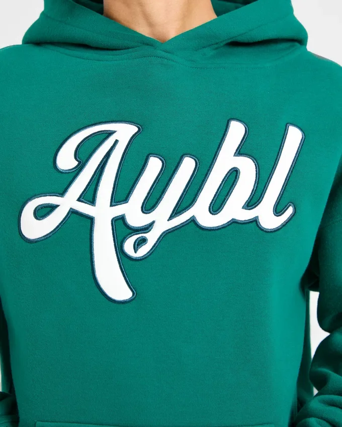Sweat à capuche oversize avec inscription brodée