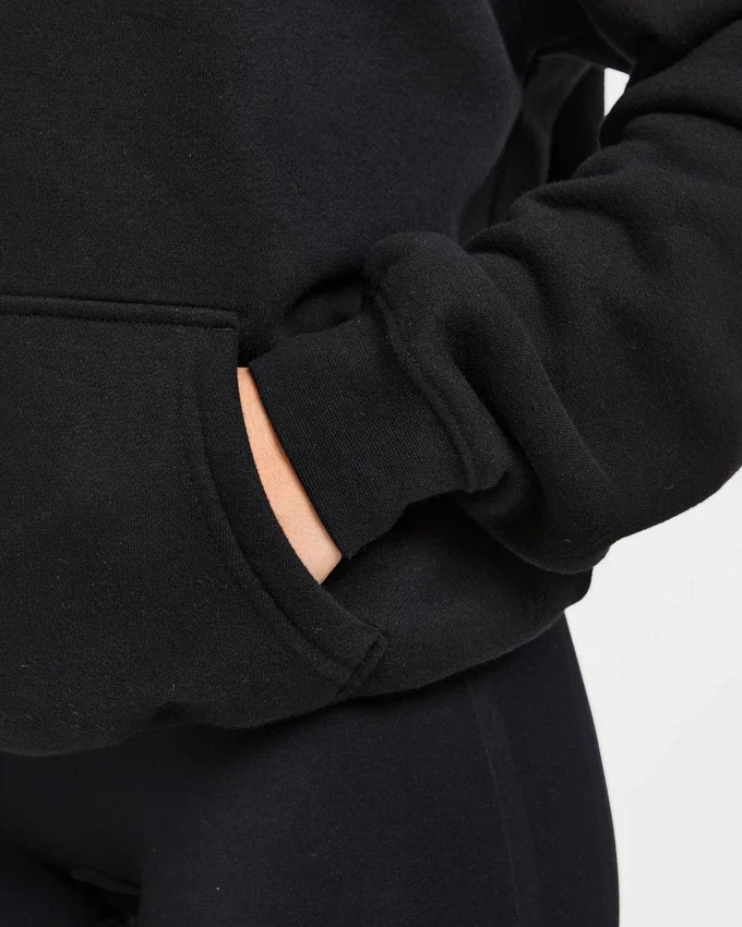 Sweat à capuche oversize avec inscription brodée
