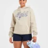 Sweat à capuche oversize avec inscription brodée