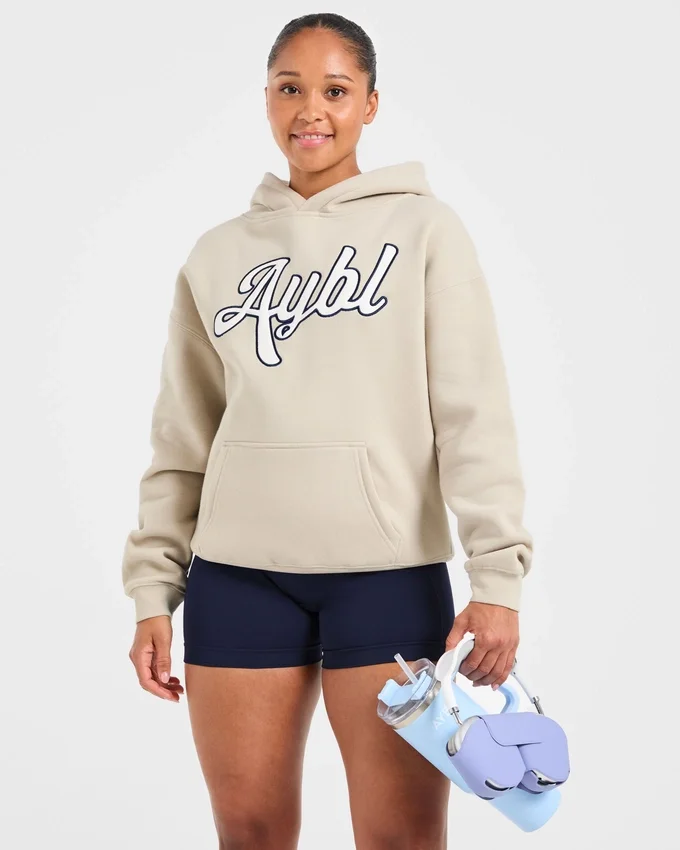 Sweat à capuche oversize avec inscription brodée