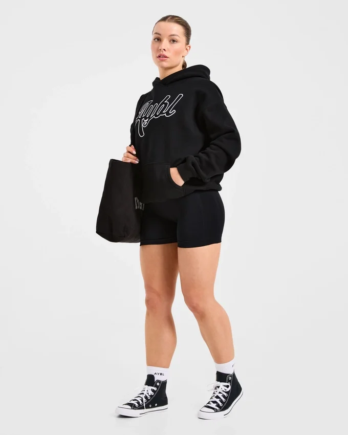 Sweat à capuche oversize avec inscription brodée