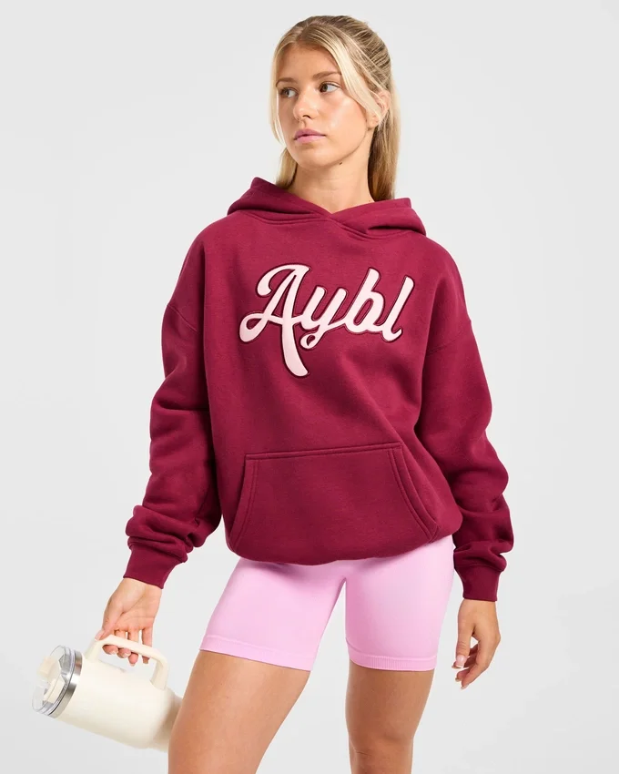 Sweat à capuche oversize avec inscription brodée