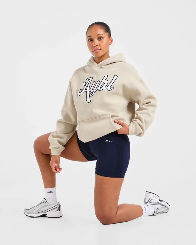 Sweat à capuche oversize avec inscription brodée