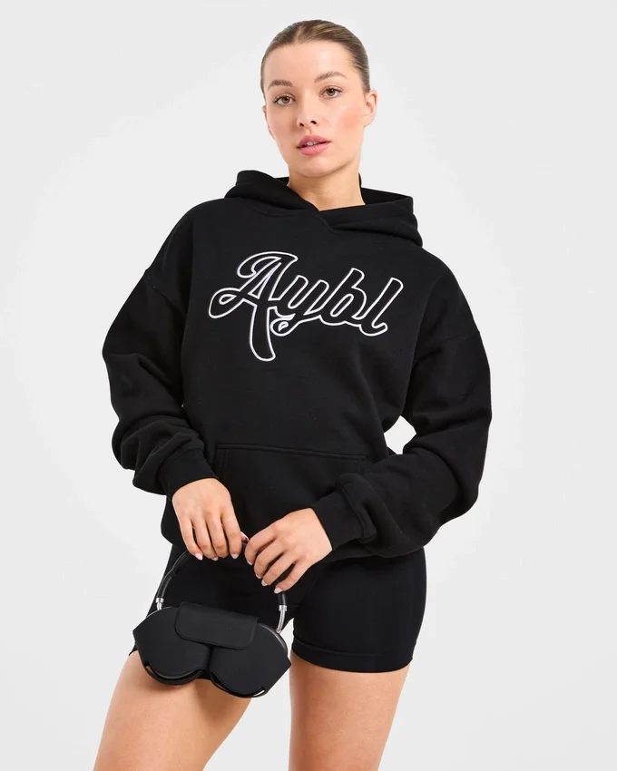 Sweat à capuche oversize avec inscription brodée